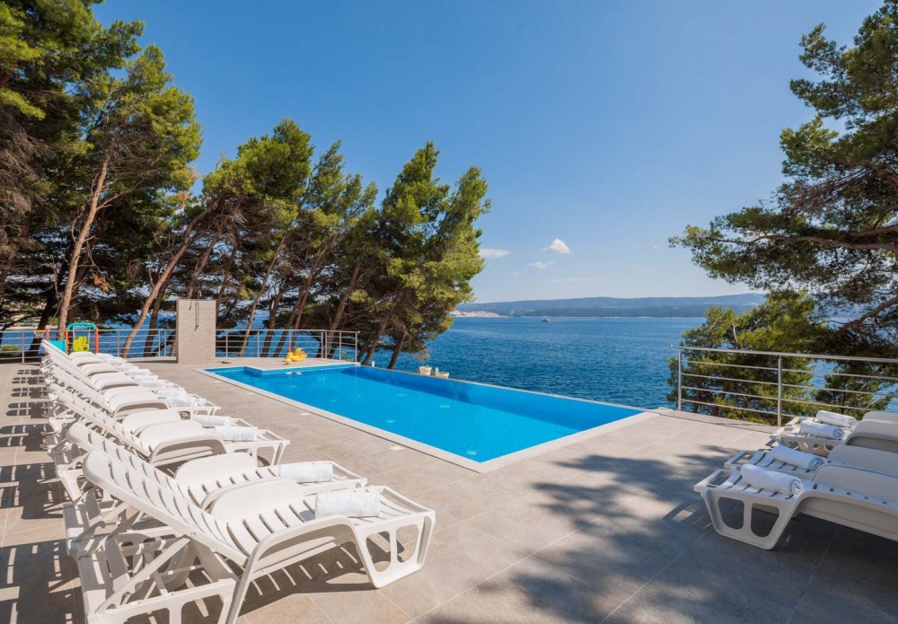 Pool, sea and pine trees